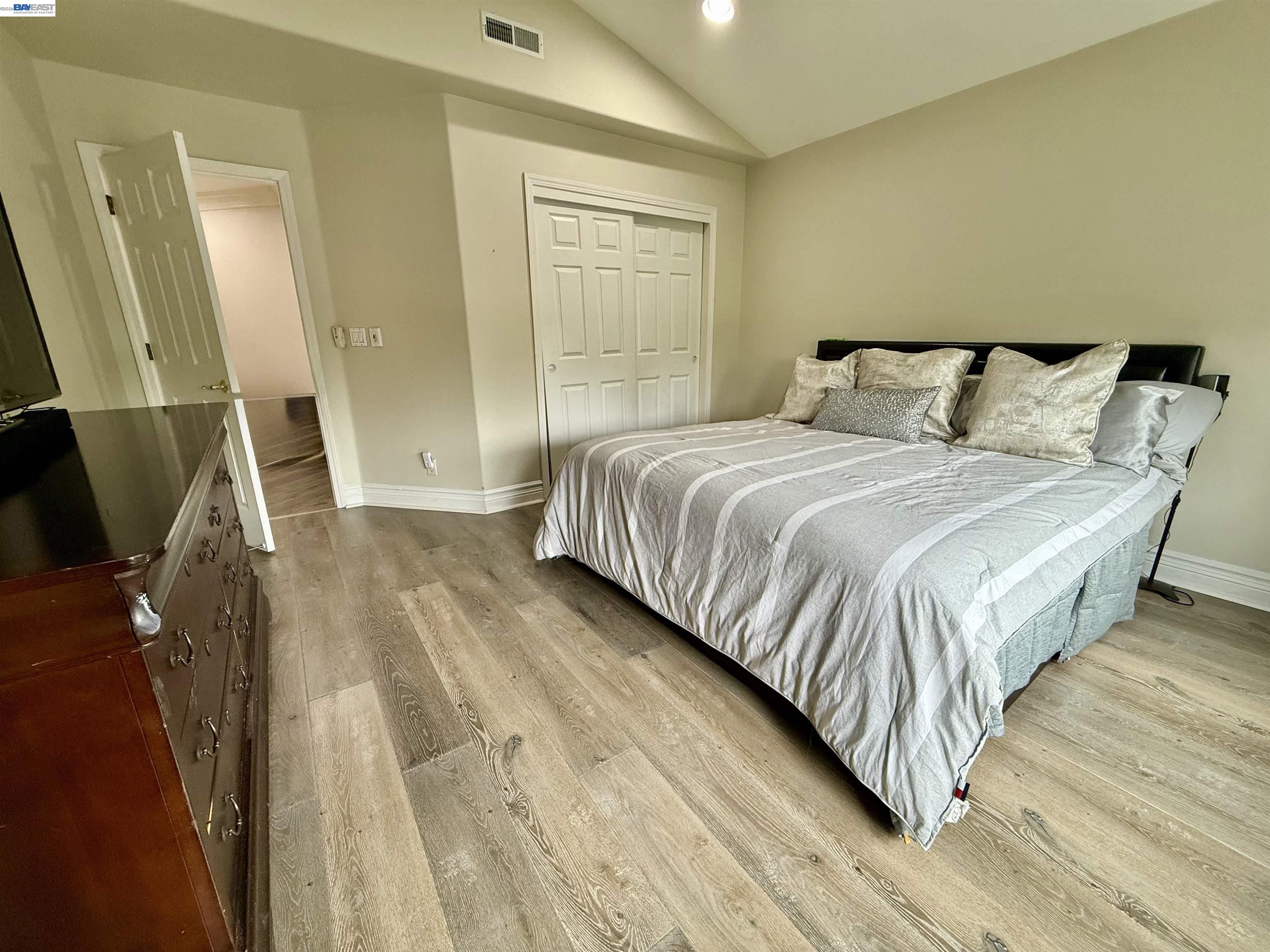 1284 Riesling Circle Livermore, CA 94550 - Photo 43 of 79 a bedroom with a bed and a mirror