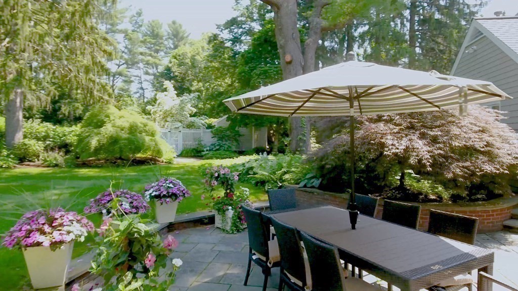 17 Cushing Street Hingham, MA 02043 - Photo 14 of 41 a view of a patio with furniture and a garden