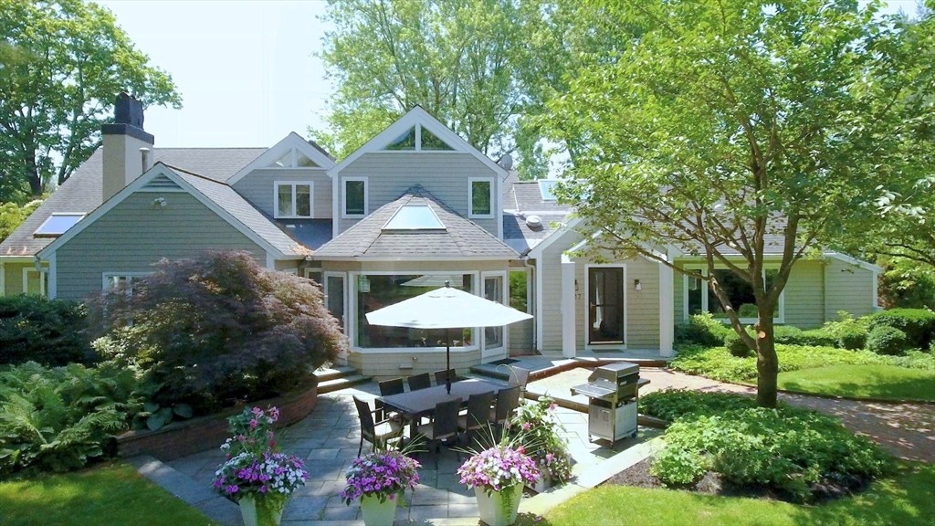 17 Cushing Street Hingham, MA 02043 - Photo 2 of 41 a front view of a house with a yard and potted plants