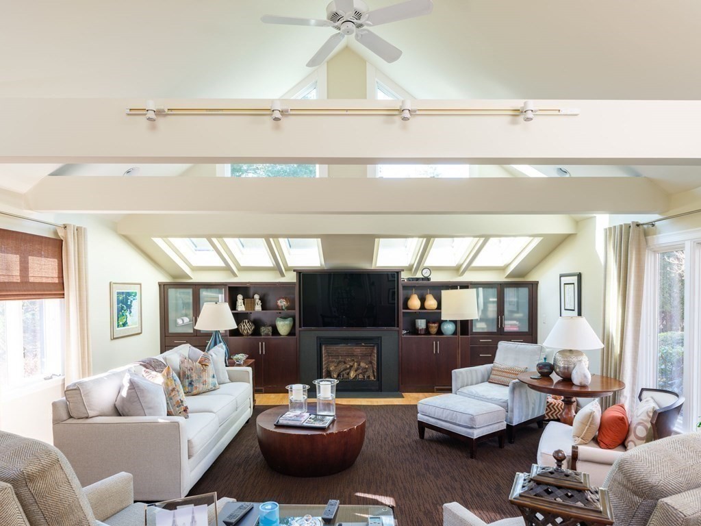 17 Cushing Street Hingham, MA 02043 - Photo 24 of 41 a living room with furniture fireplace and a large window