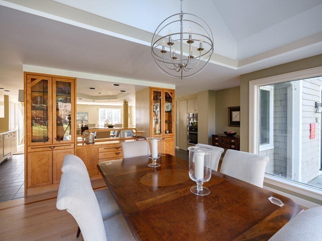 17 Cushing Street Hingham, MA 02043 - Photo 32 of 41 a view of a dining room with furniture a chandelier and wooden floor