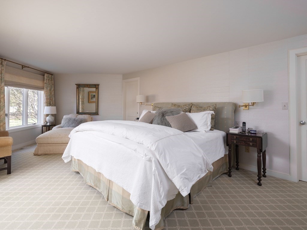 17 Cushing Street Hingham, MA 02043 - Photo 35 of 41 a bedroom with a bed and a large mirror