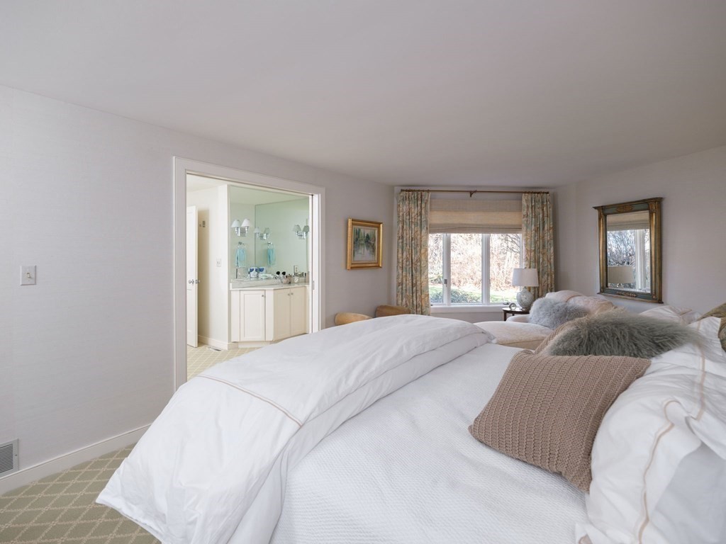 17 Cushing Street Hingham, MA 02043 - Photo 36 of 41 a bedroom with a large bed and wooden floor