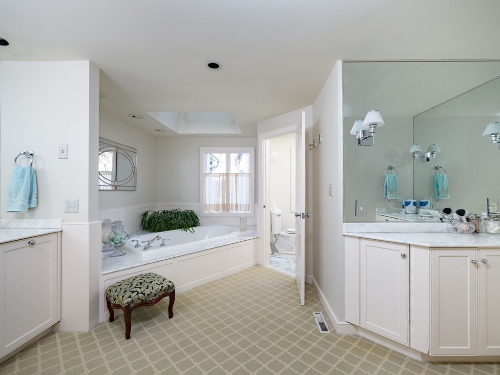 17 Cushing Street Hingham, MA 02043 - Photo 37 of 41 a spacious bathroom with a sink a mirror and shower