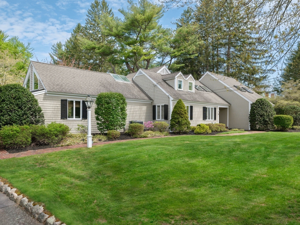 17 Cushing Street Hingham, MA 02043 - Photo 40 of 41 a front view of a house with a yard and trees
