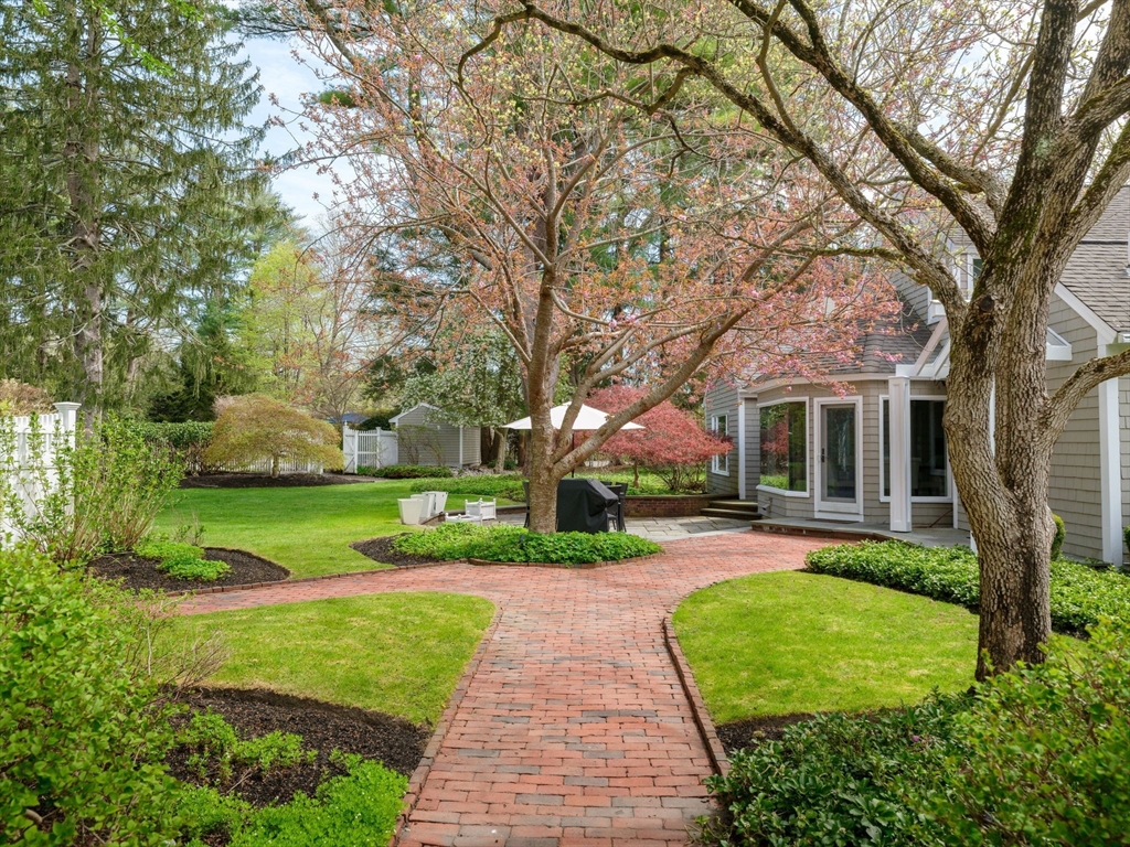 17 Cushing Street Hingham, MA 02043 - Photo 4 of 41 a front view of a house with a yard and large trees