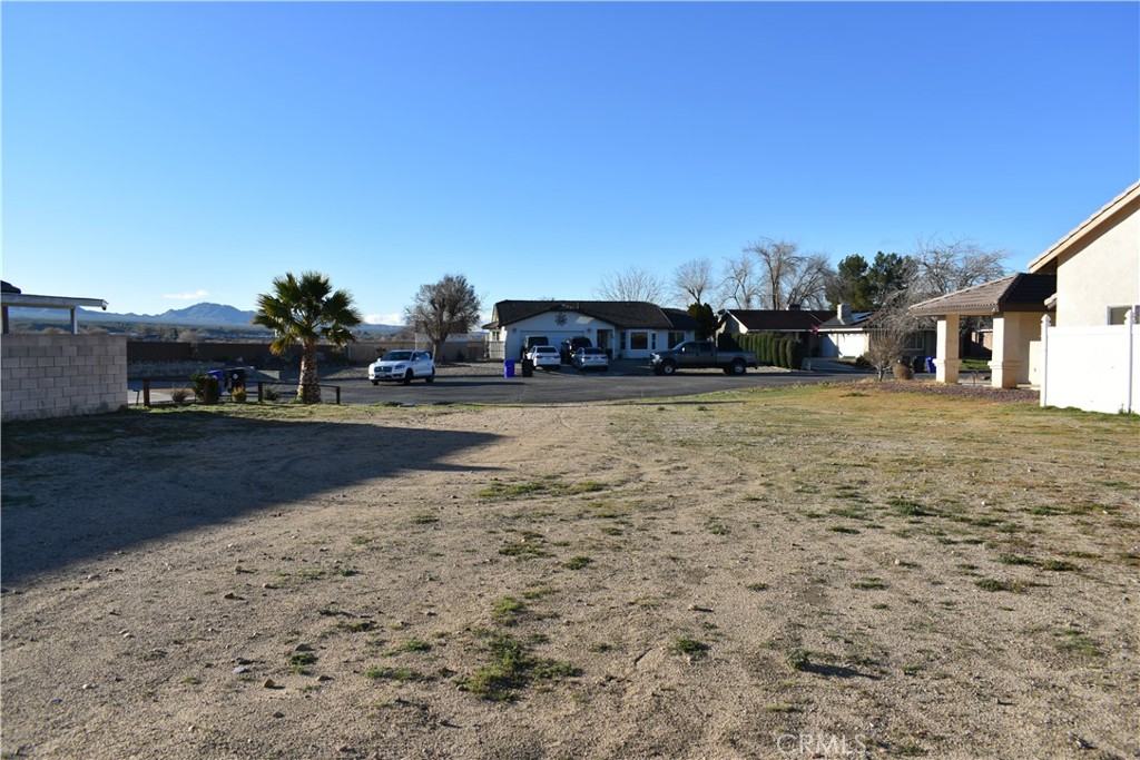 14988 Rivers Edge Road Helendale, CA 92342 - Photo 39 of 39 a view of swimming pool with outdoor seating and covered with trees in the background
