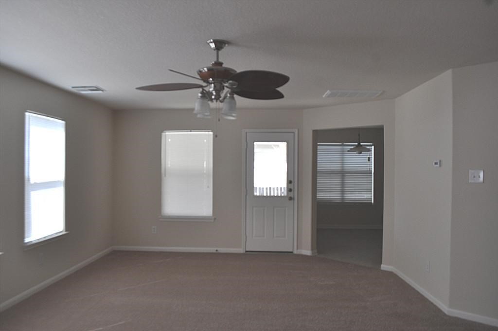 4911 Amorgas Isle Drive Spring, TX 77389 - Photo 7 of 14 Living room to den