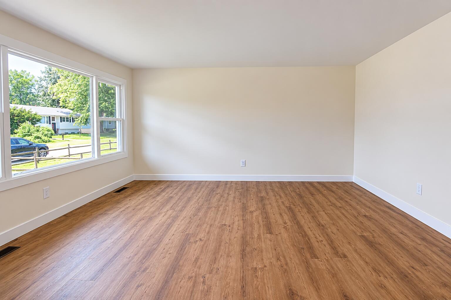 414 Holly Road Michigan City, IN 46360 - Photo 9 of 41 an empty room with wooden floor and windows