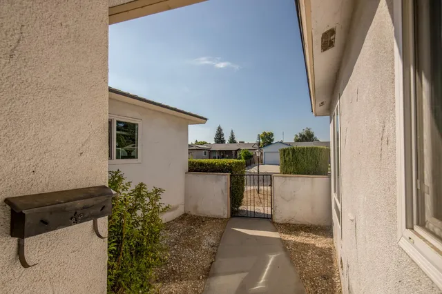a kitchen with a sink and a stove top oven