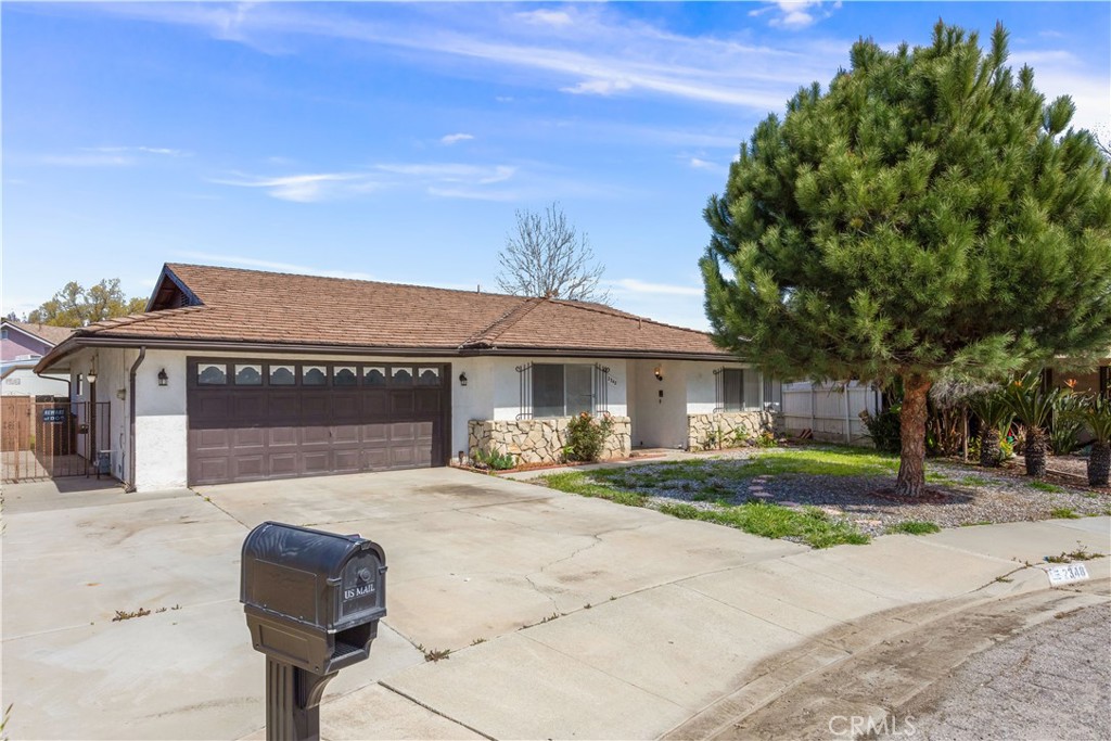 2348 Los Altos Circle Hemet, CA 92545 - Photo 2 of 35 a front view of a house with a yard and garage