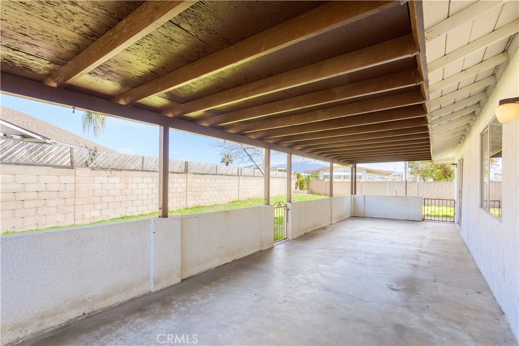 2348 Los Altos Circle Hemet, CA 92545 - Photo 21 of 35 a view of an empty room with a sliding door
