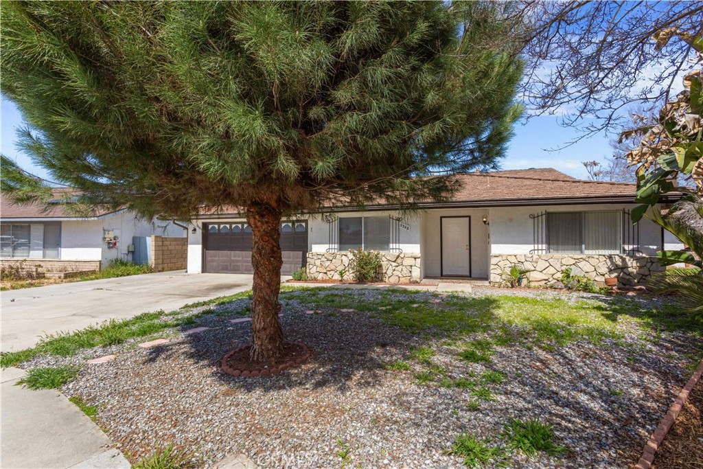 2348 Los Altos Circle Hemet, CA 92545 - Photo 3 of 35 a front view of a house with a garden