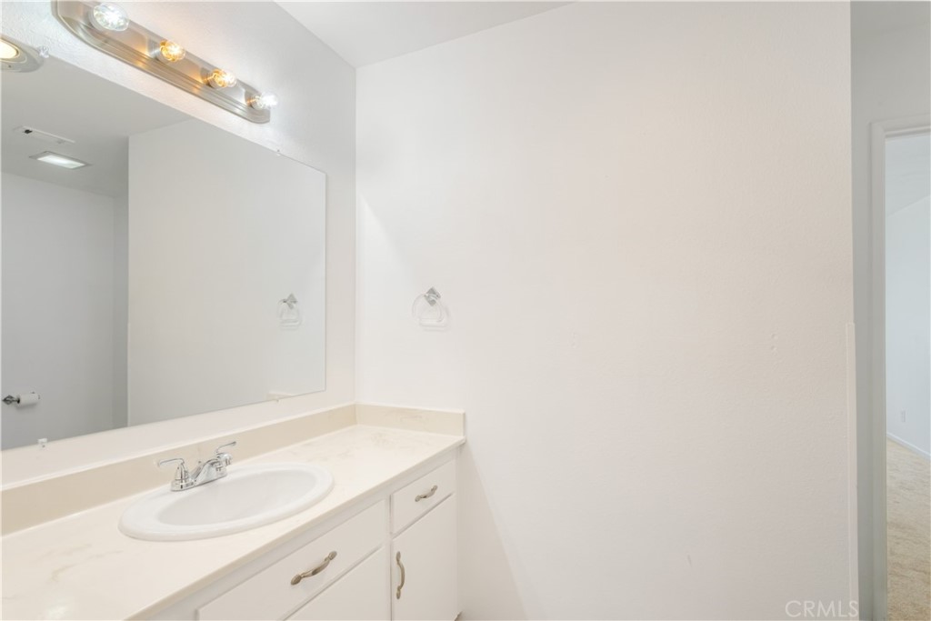 2348 Los Altos Circle Hemet, CA 92545 - Photo 31 of 35 a bathroom with a sink and a mirror