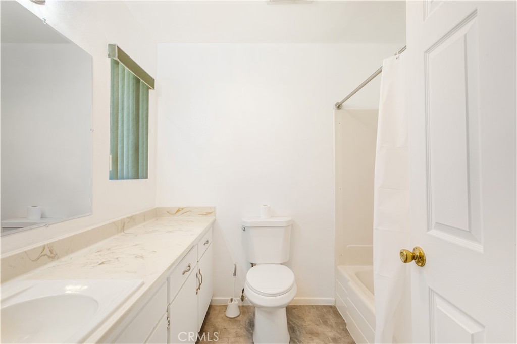 2348 Los Altos Circle Hemet, CA 92545 - Photo 35 of 35 a bathroom with a sink and toilet