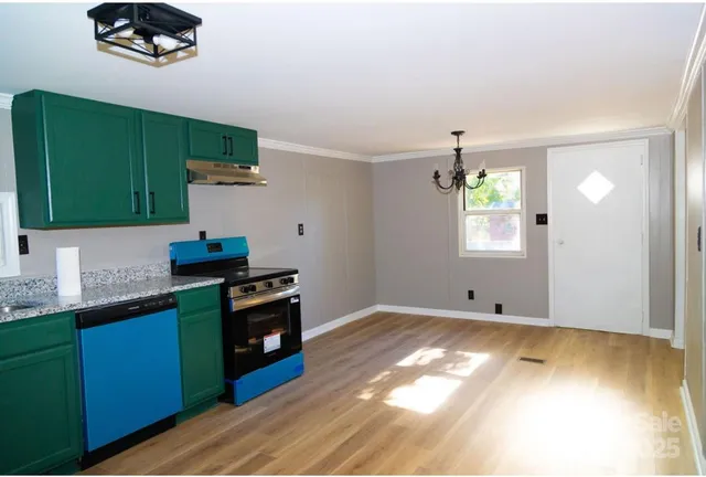 a kitchen with a sink and large window