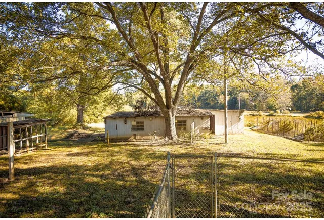 a front view of a building with a garden