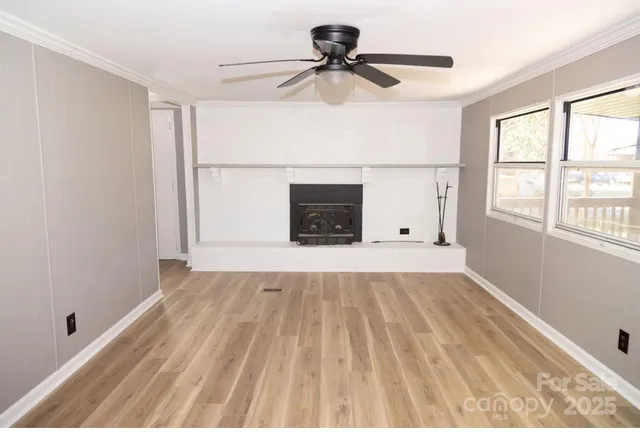 a black and white wall with a fireplace