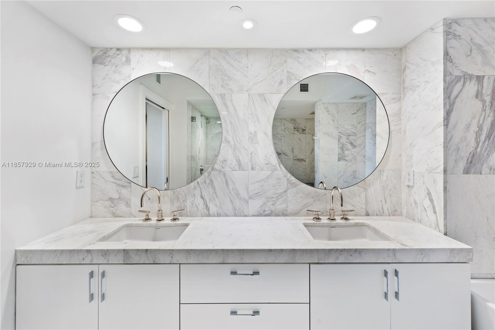 400 Alton Road, Unit 1405 Miami Beach, FL 33139 - Photo 11 of 18 a bathroom with a double vanity sink and a mirror
