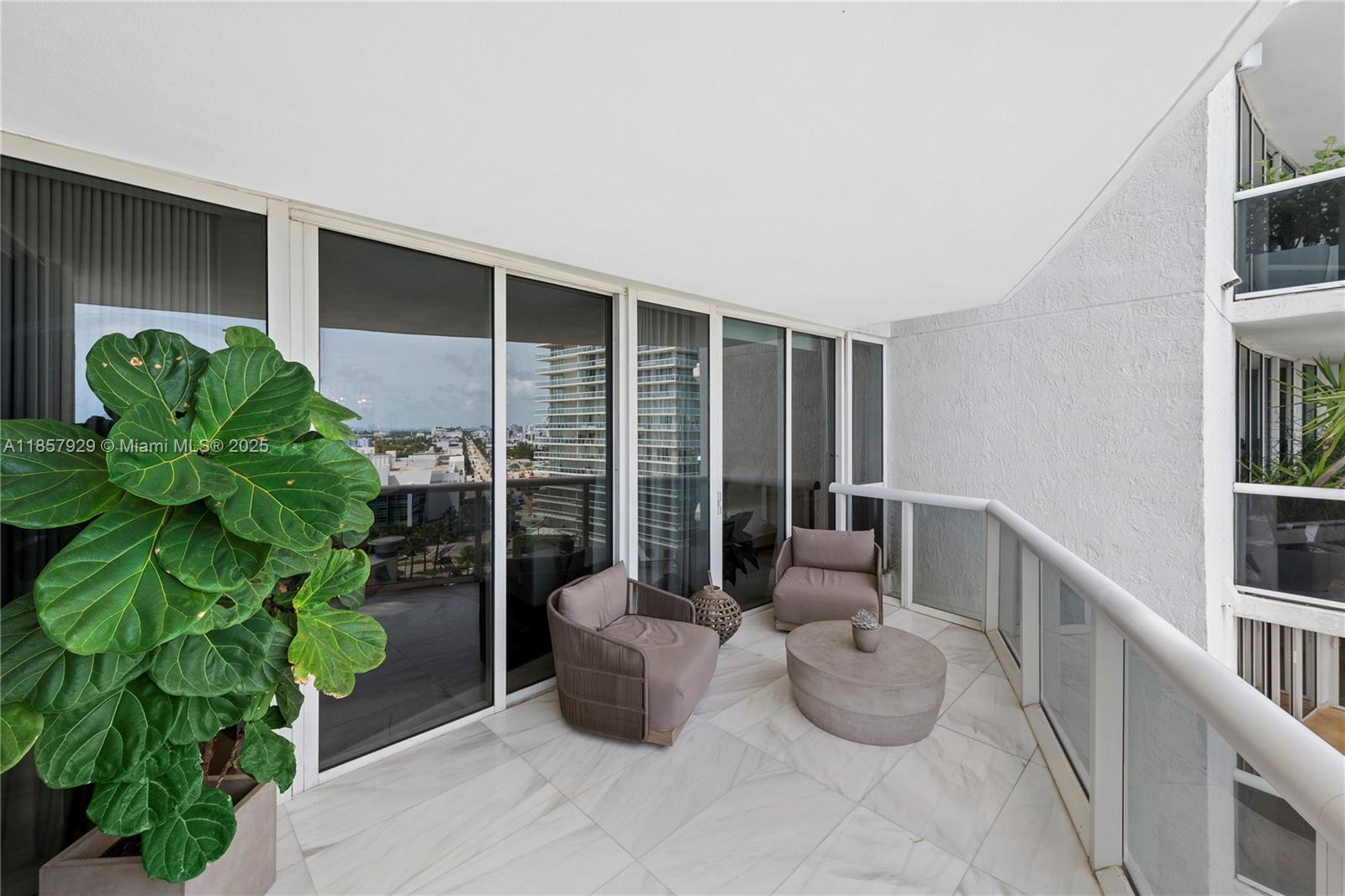 400 Alton Road, Unit 1405 Miami Beach, FL 33139 - Photo 17 of 18 a room with lots of potted plants