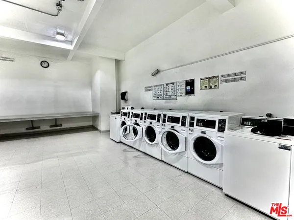 a kitchen with a stove a microwave and a refrigerator