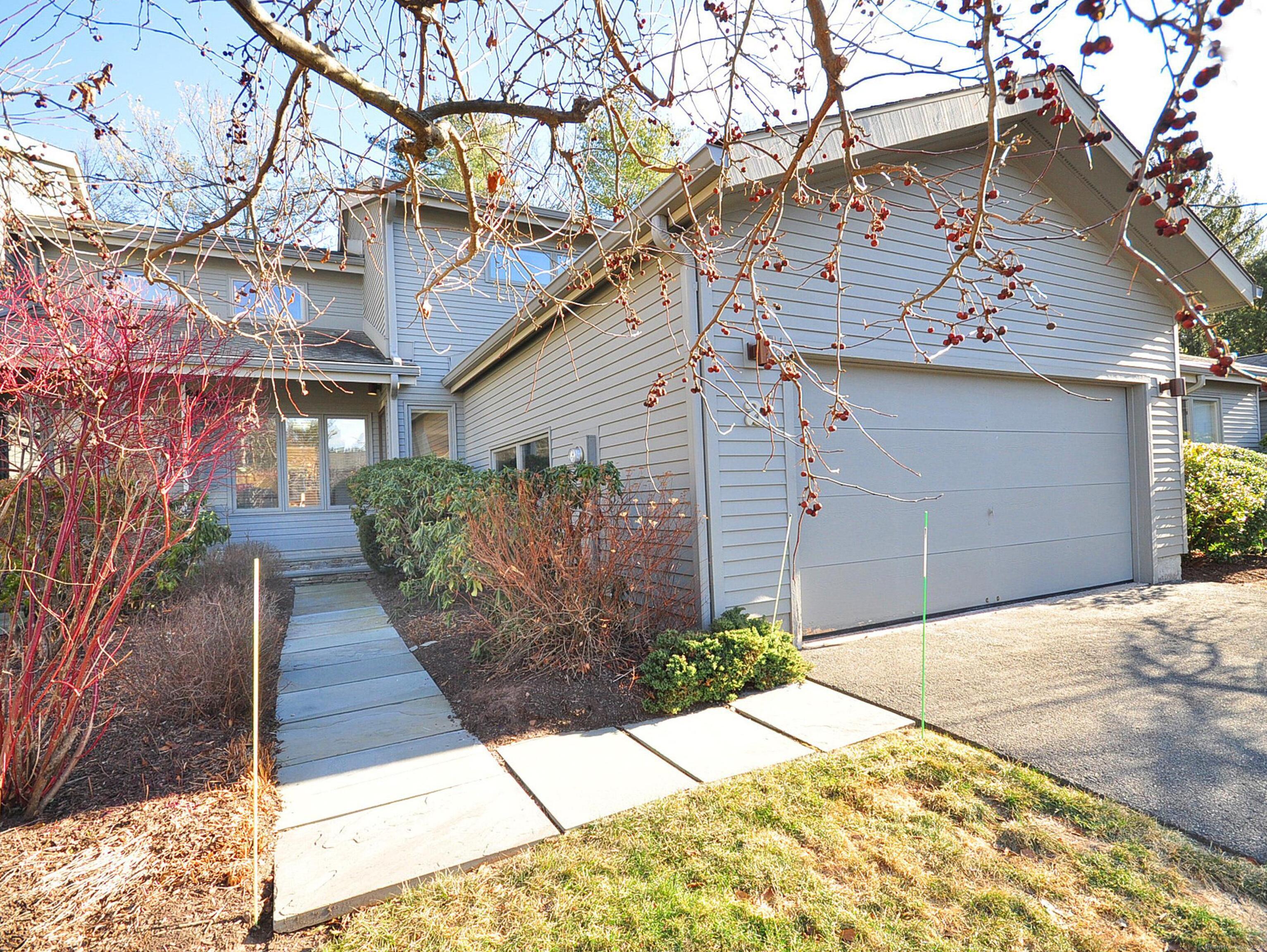 a view of a house with a street