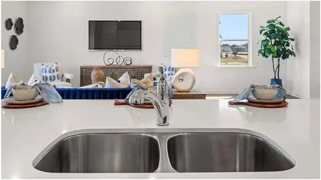 a kitchen with cabinets and stainless steel appliances