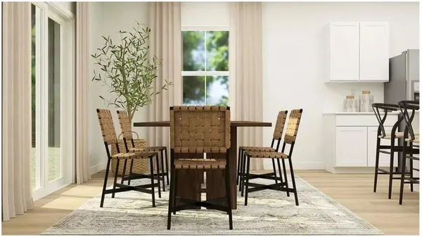 a view of a dining room with furniture and window