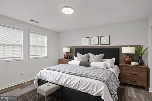 a bedroom with a bed and window