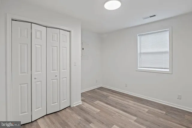 a view of a livingroom with wooden floor