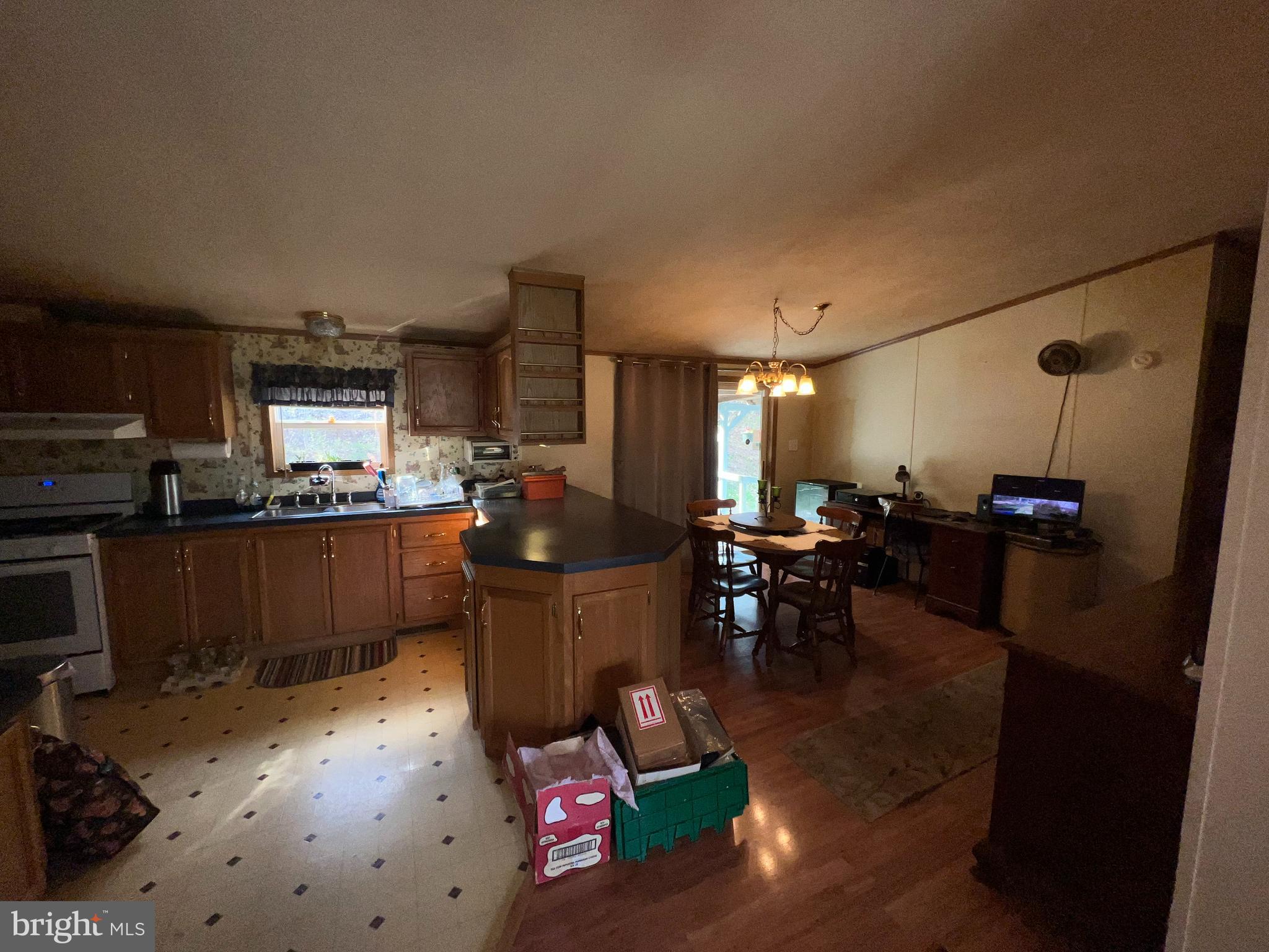 957 Cider Press Road Manheim, PA 17545 - Photo 5 of 16 a living room with furniture a dining table and kitchen view