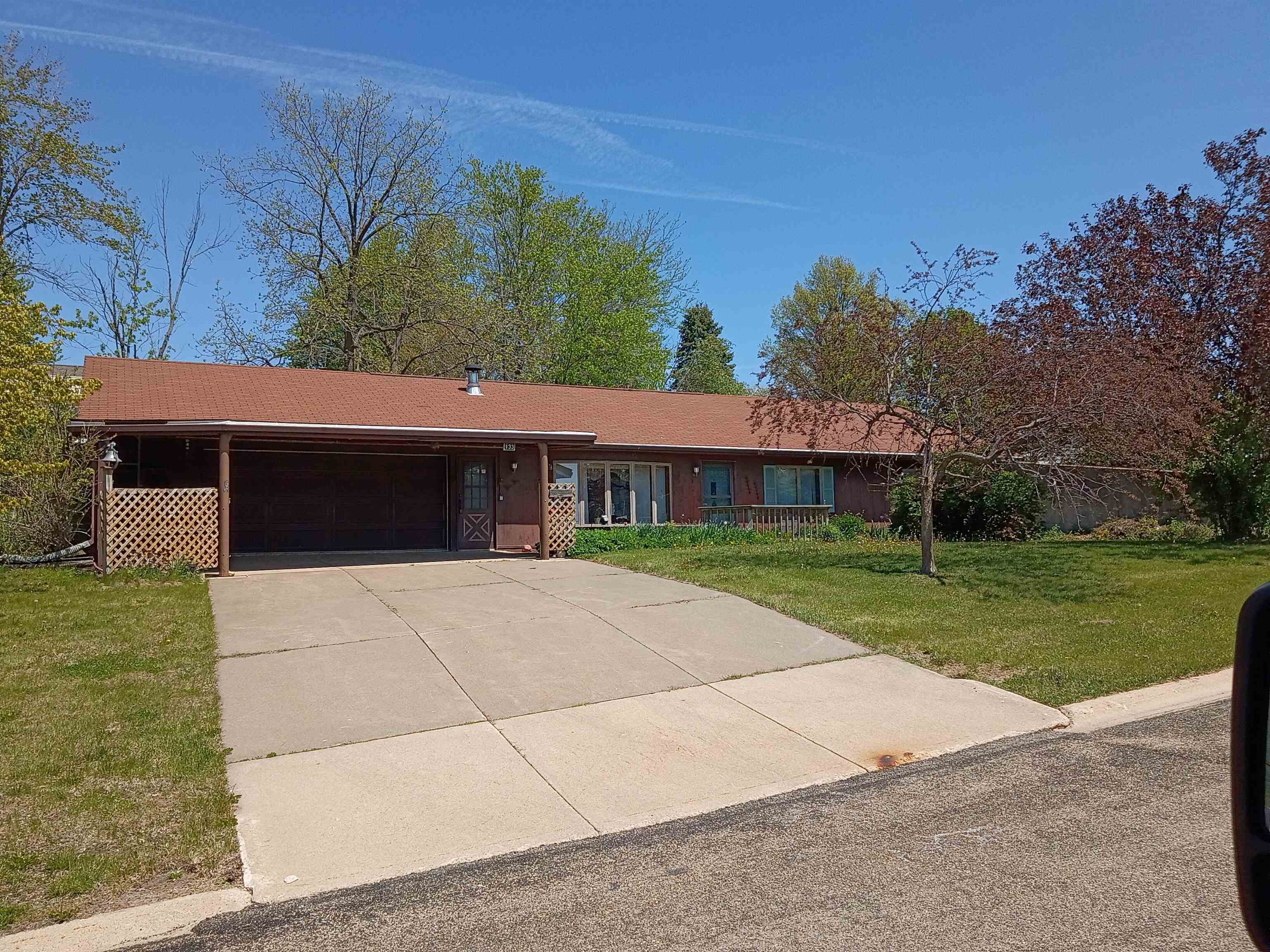 133 Mathilda Drive Stockton, IL 61085 - Photo 1 of 15 a front view of a house with a yard and garage