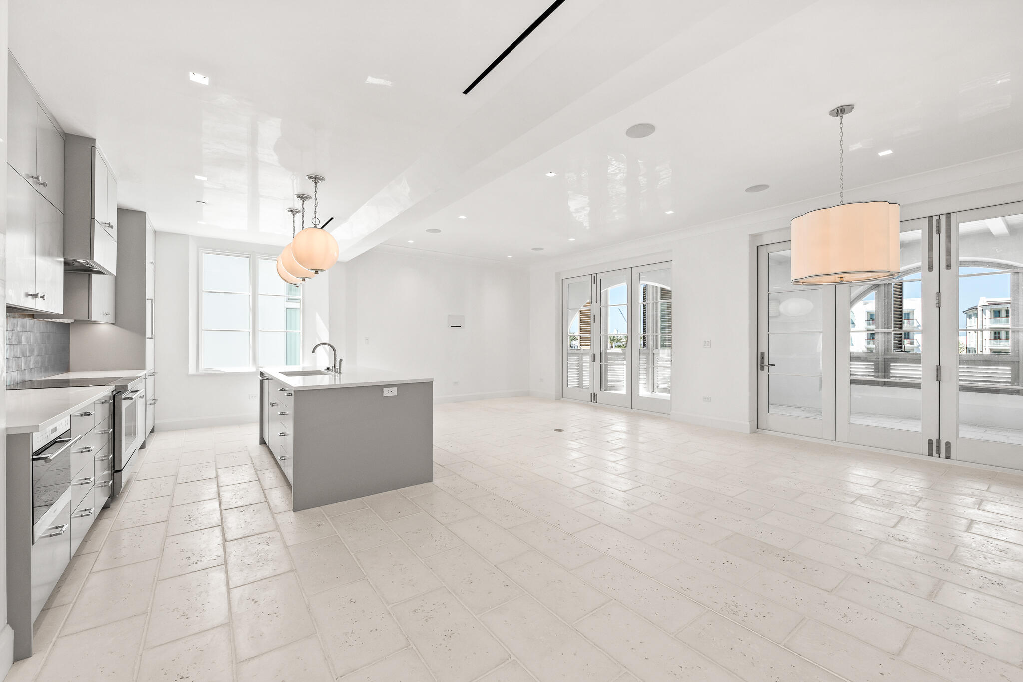 30 Mark Twain Lane, Unit 303 Inlet Beach, FL 32461 - Photo 11 of 34 a large kitchen with a large counter top appliances and cabinets