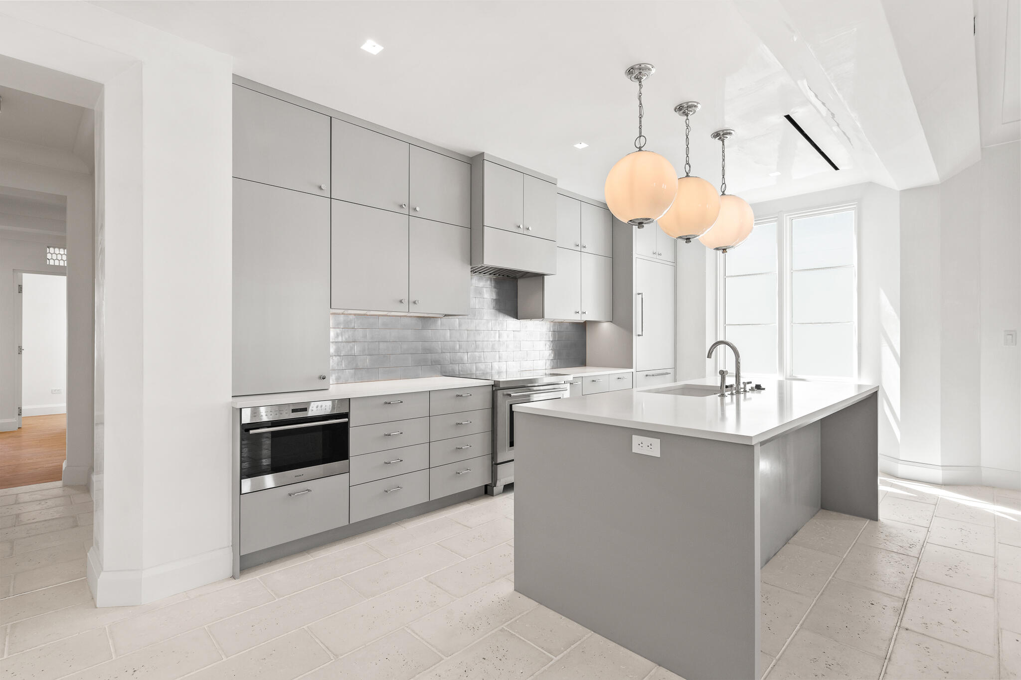 30 Mark Twain Lane, Unit 303 Inlet Beach, FL 32461 - Photo 14 of 34 a kitchen with kitchen island a sink stainless steel appliances and cabinets