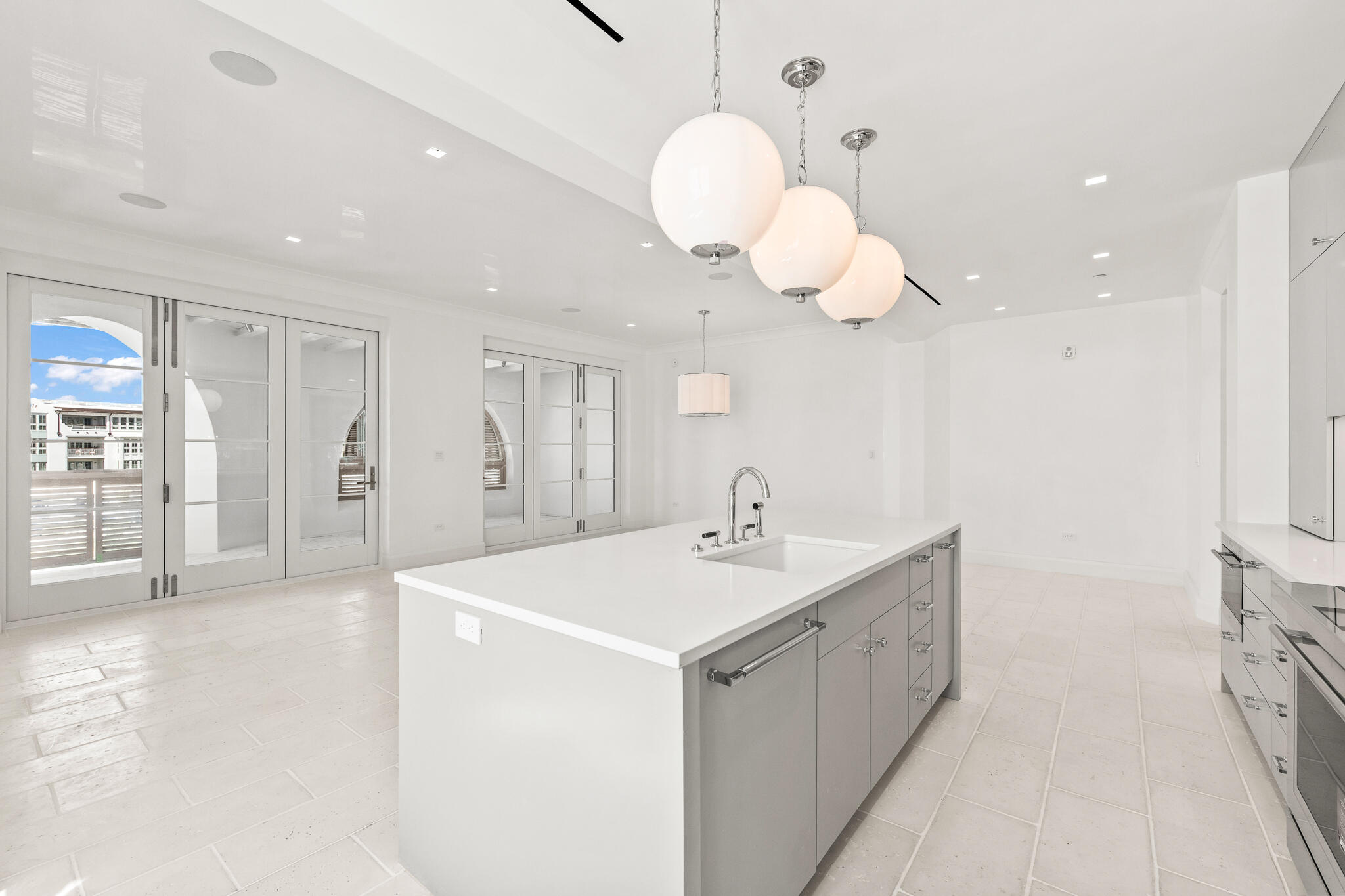 30 Mark Twain Lane, Unit 303 Inlet Beach, FL 32461 - Photo 17 of 34 a kitchen with a sink a counter space and chandelier