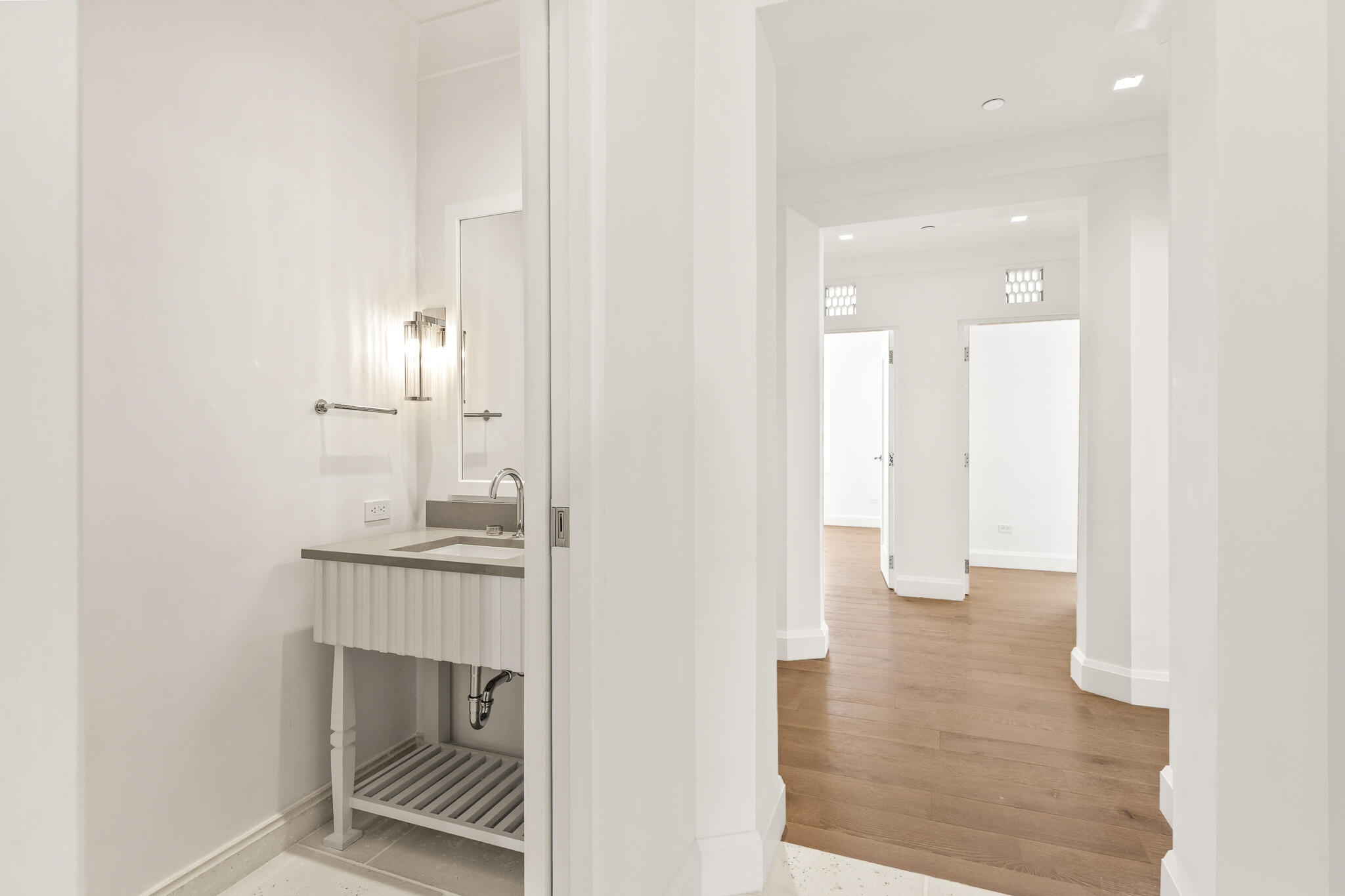 30 Mark Twain Lane, Unit 303 Inlet Beach, FL 32461 - Photo 20 of 34 an empty room with wooden floor and bathroom view