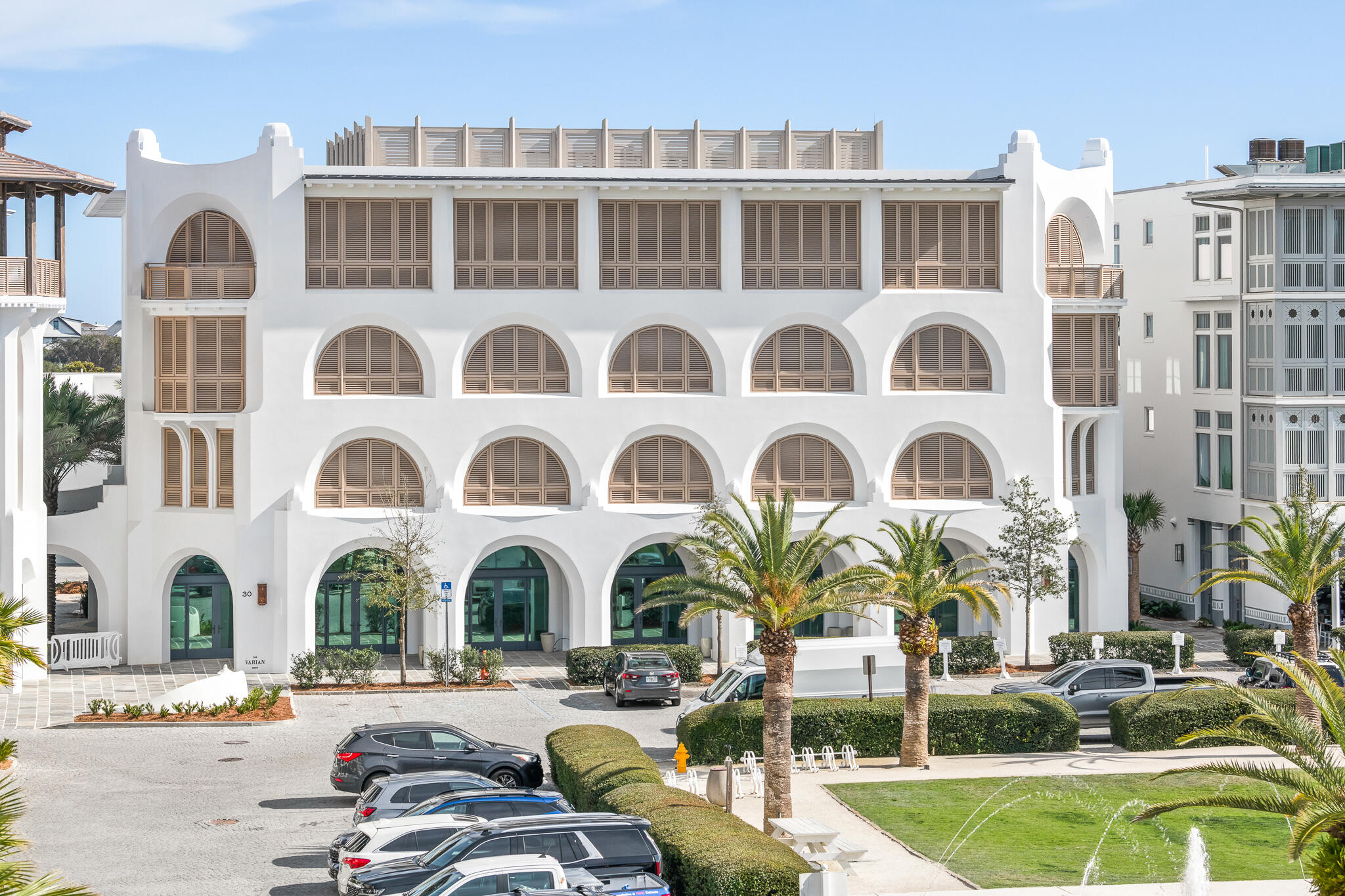 30 Mark Twain Lane, Unit 303 Inlet Beach, FL 32461 - Photo 2 of 34 a front view of a multi story building with yard and outdoor seating