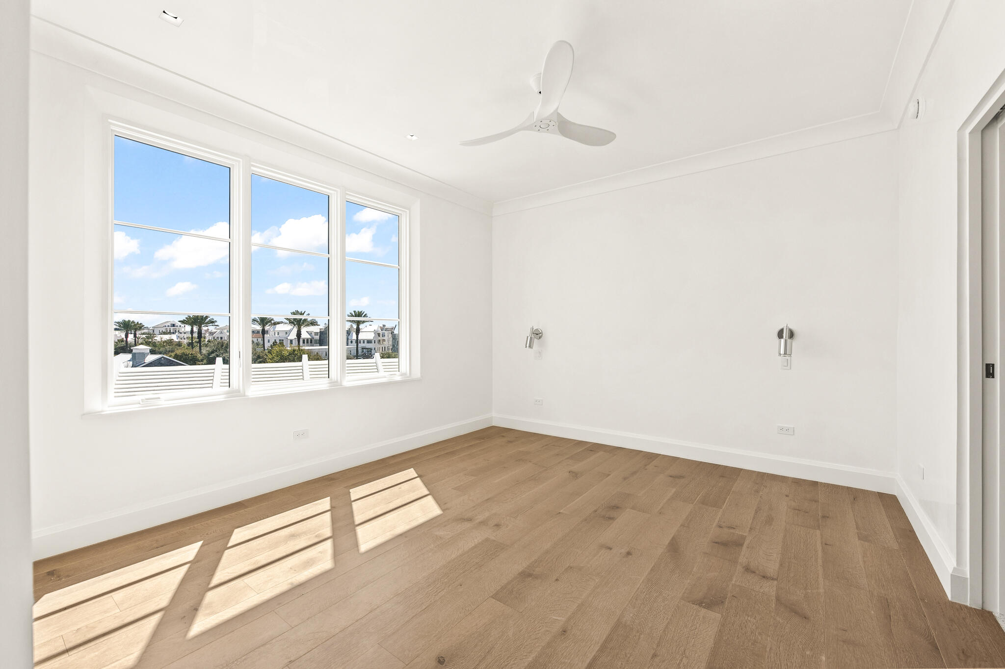 30 Mark Twain Lane, Unit 303 Inlet Beach, FL 32461 - Photo 23 of 34 an empty room with wooden floor and windows