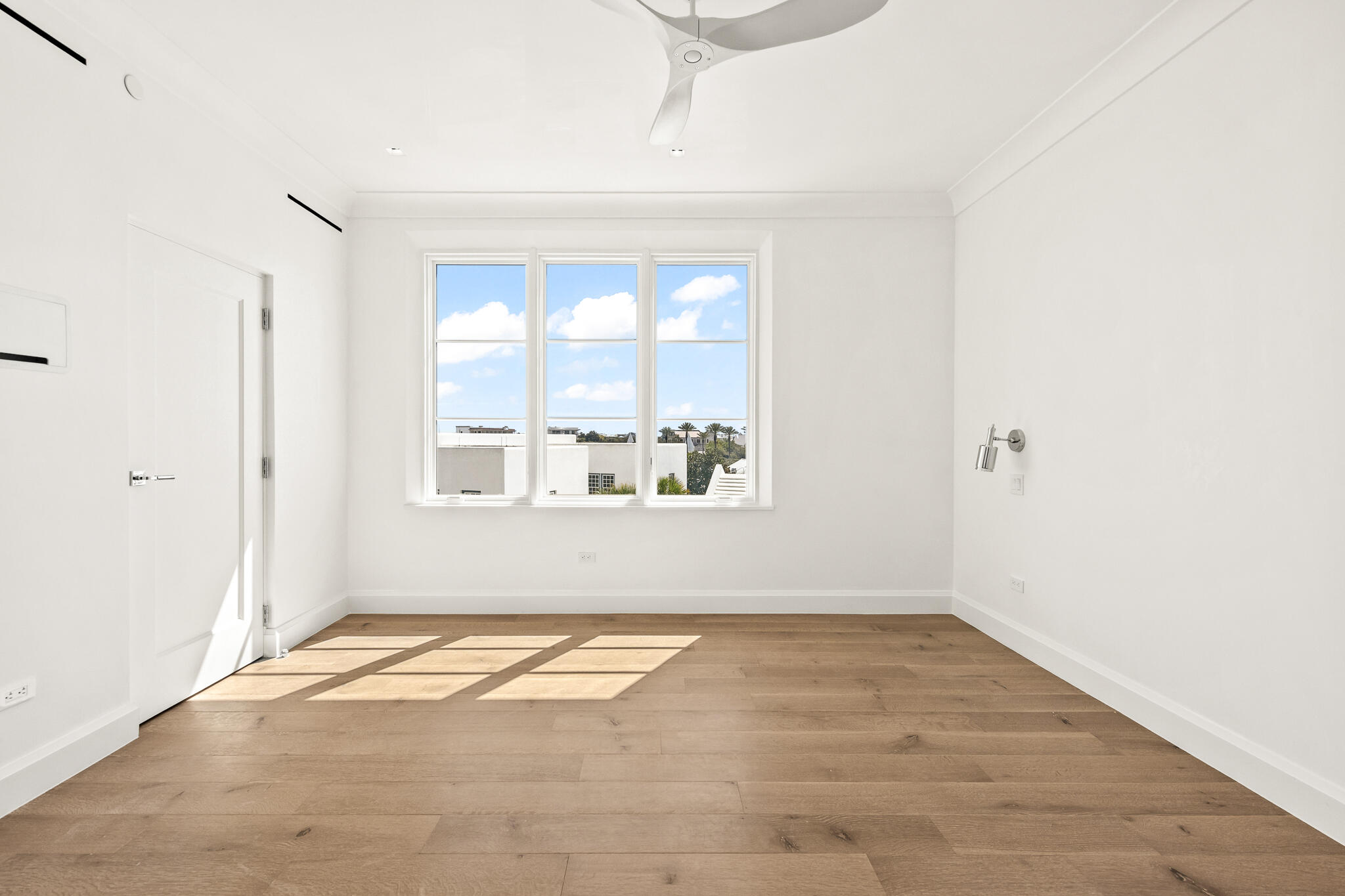 30 Mark Twain Lane, Unit 303 Inlet Beach, FL 32461 - Photo 25 of 34 an empty room with wooden floor and windows