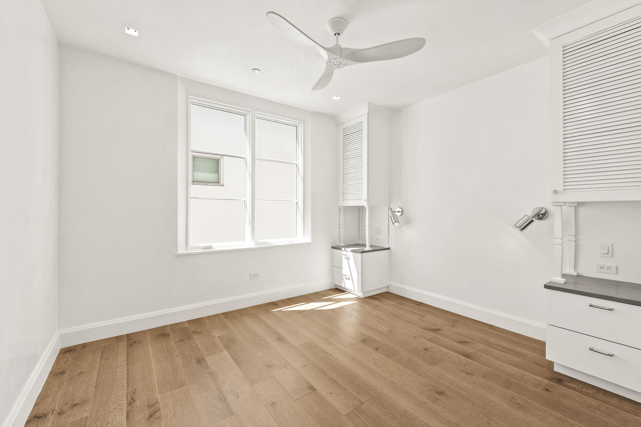 30 Mark Twain Lane, Unit 303 Inlet Beach, FL 32461 - Photo 28 of 34 an empty room with wooden floor and windows