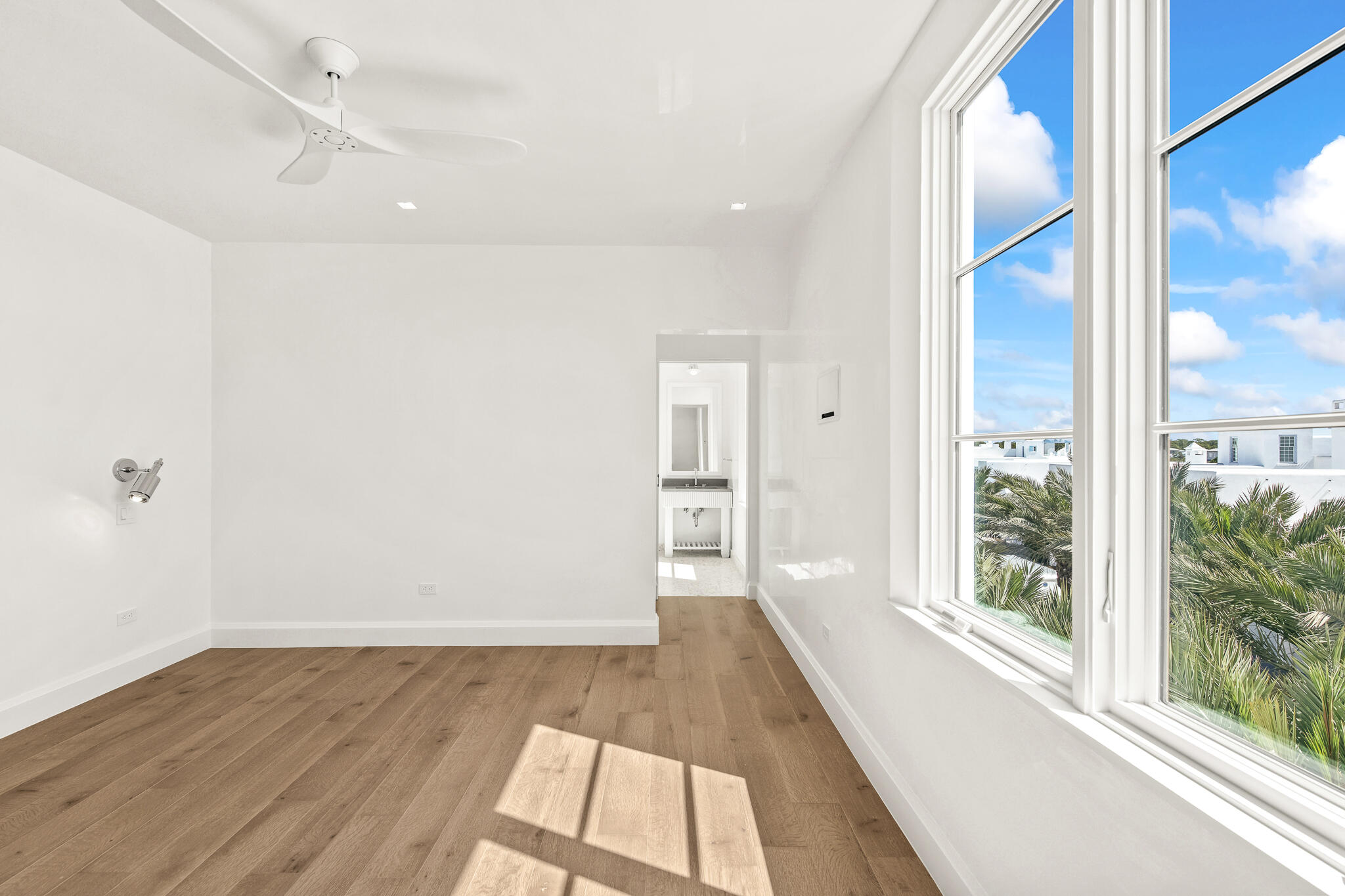 30 Mark Twain Lane, Unit 303 Inlet Beach, FL 32461 - Photo 29 of 34 a view of a hallway with wooden floor and a bathroom