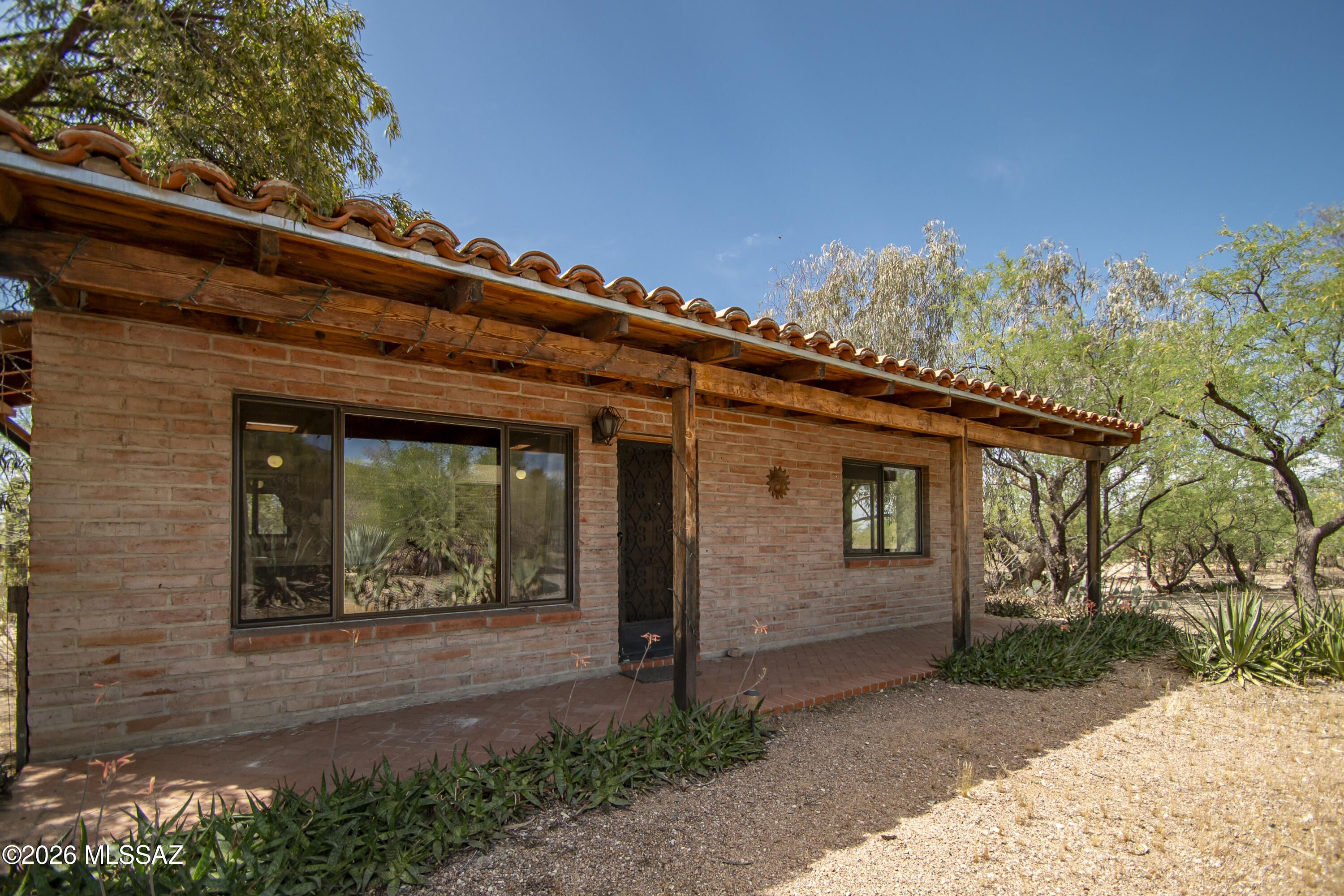 4130 East River Road Tucson, AZ 85718 - Photo 33 of 46 a front view of a house with a yard