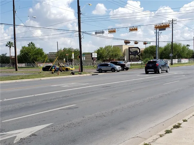 a view of a street with cars