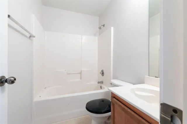 a bathroom with a bathtub toilet and sink