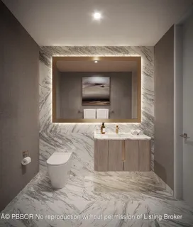 a bathroom with a sink toilet and mirror