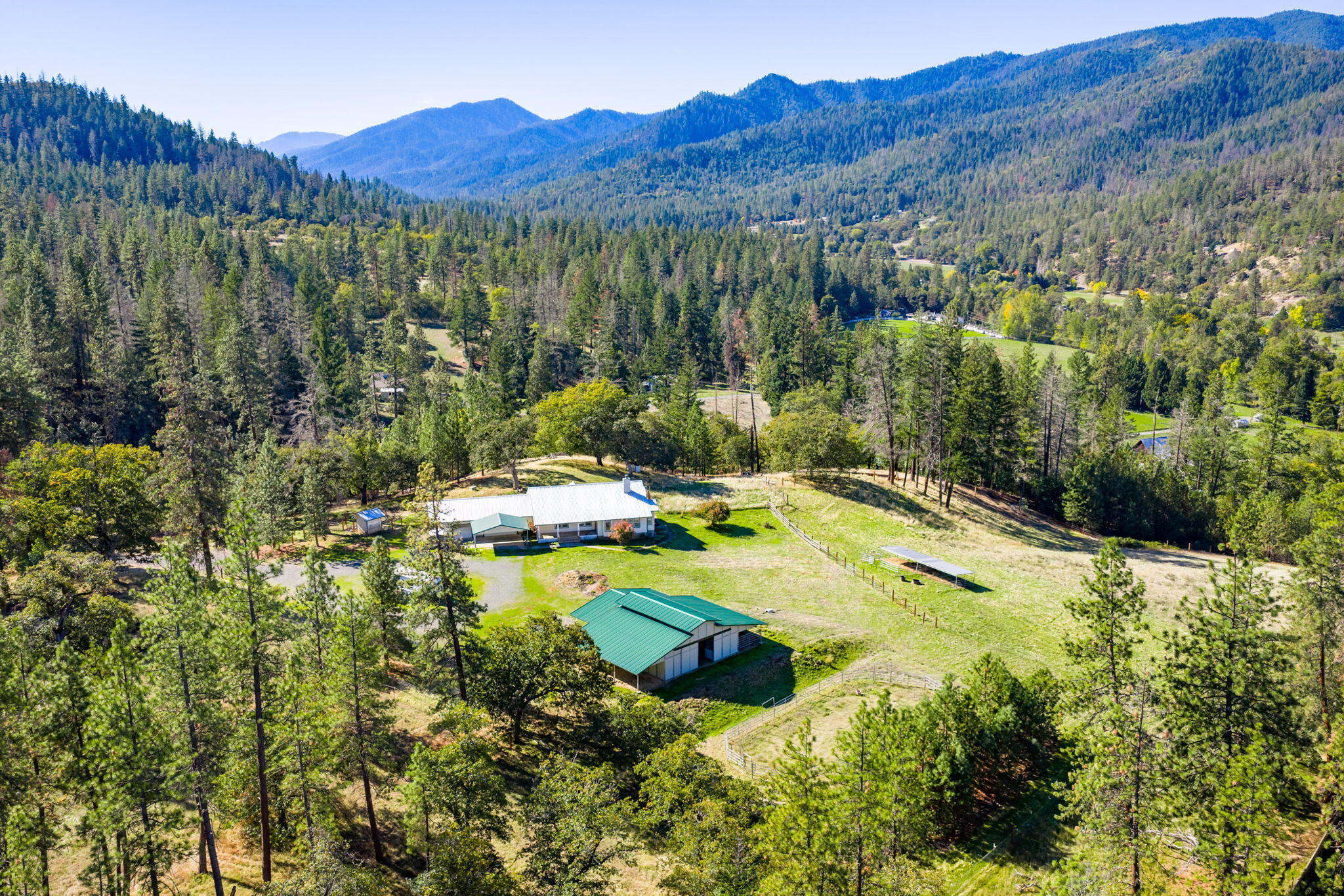 2467 Eastside Road Jacksonville, OR 97530 - Photo 1 of 85 a view of a mountain with an outdoor space and seating area