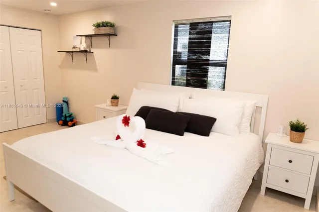 a bedroom with a bed and a cabinets