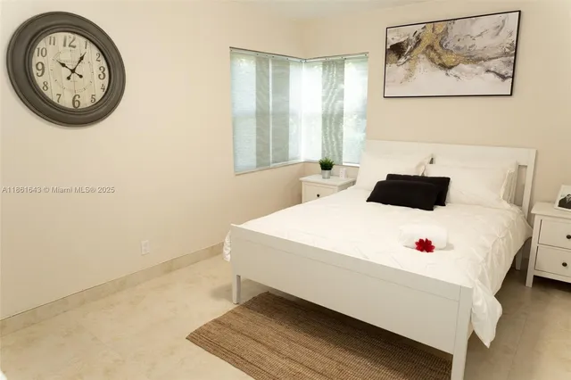 a bedroom with a bed and a desk