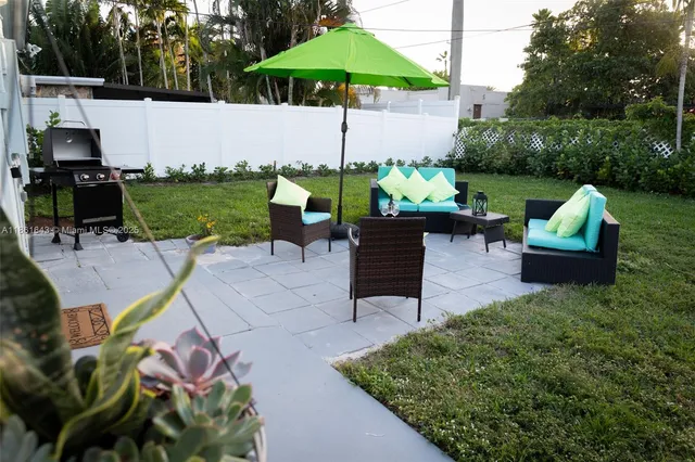 a view of a patio with couches chairs and a table