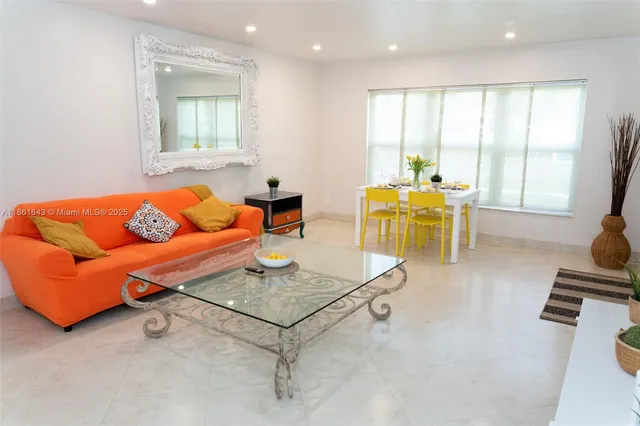 a living room with furniture and a table